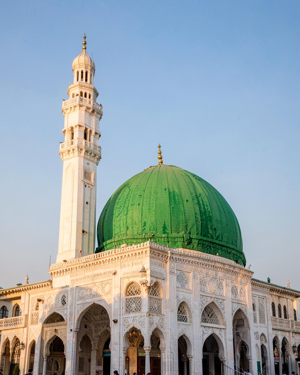 Green dome and minaret of a mosque